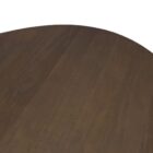 Dark wood oval dining table with sculpted fluted pedestal base.
