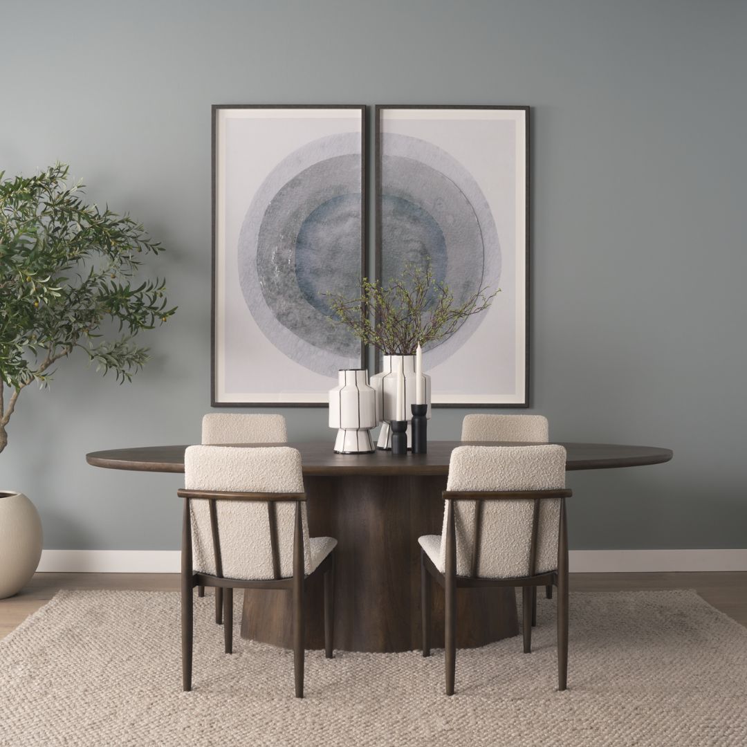 Dark wood oval dining table with sculpted fluted pedestal base.