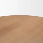 Round natural wood dining table with sculptural pedestal base.