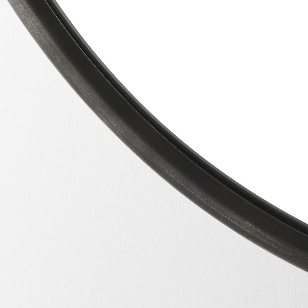 Round wall mirror with slim metal frame.