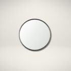 Round wall mirror with slim metal frame.