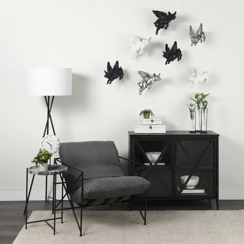 Black metal accent cabinet with glass double doors featuring crisscross design and interior shelving.