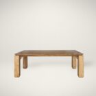Rectangular solid wood dining table with angled apron detail and block legs in a warm golden-brown finish.