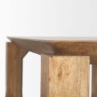 Rectangular solid wood dining table with angled apron detail and block legs in a warm golden-brown finish.