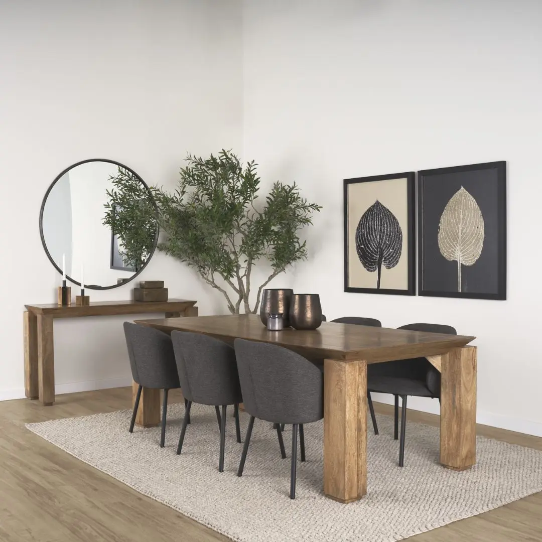 Rectangular solid wood dining table with angled apron detail and block legs in a warm golden-brown finish.