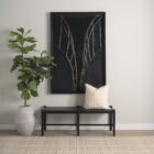A minimalist black wood bench with a woven black leather seat, featuring clean lines and an open-frame base.