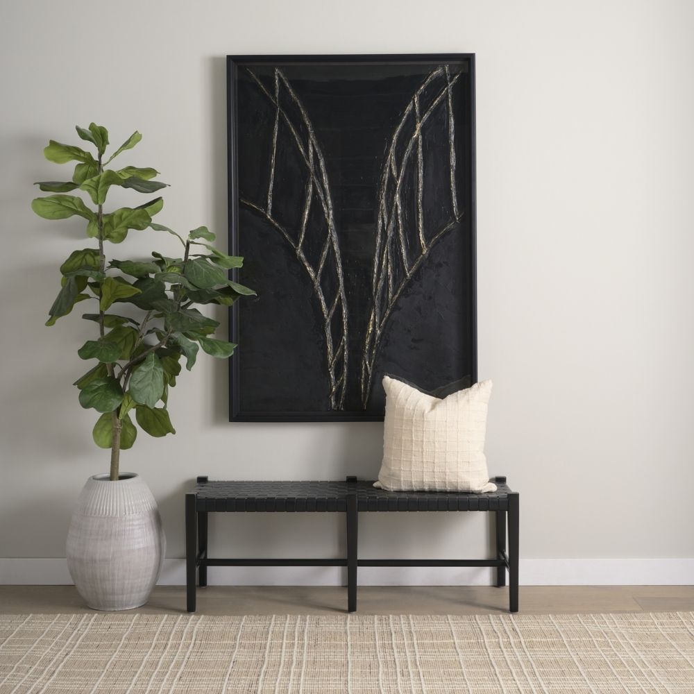 A minimalist black wood bench with a woven black leather seat, featuring clean lines and an open-frame base.