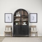 A tall arched black wood cabinet with open shelving and a black metal frame, featuring natural wood interior and closed bottom doors.
