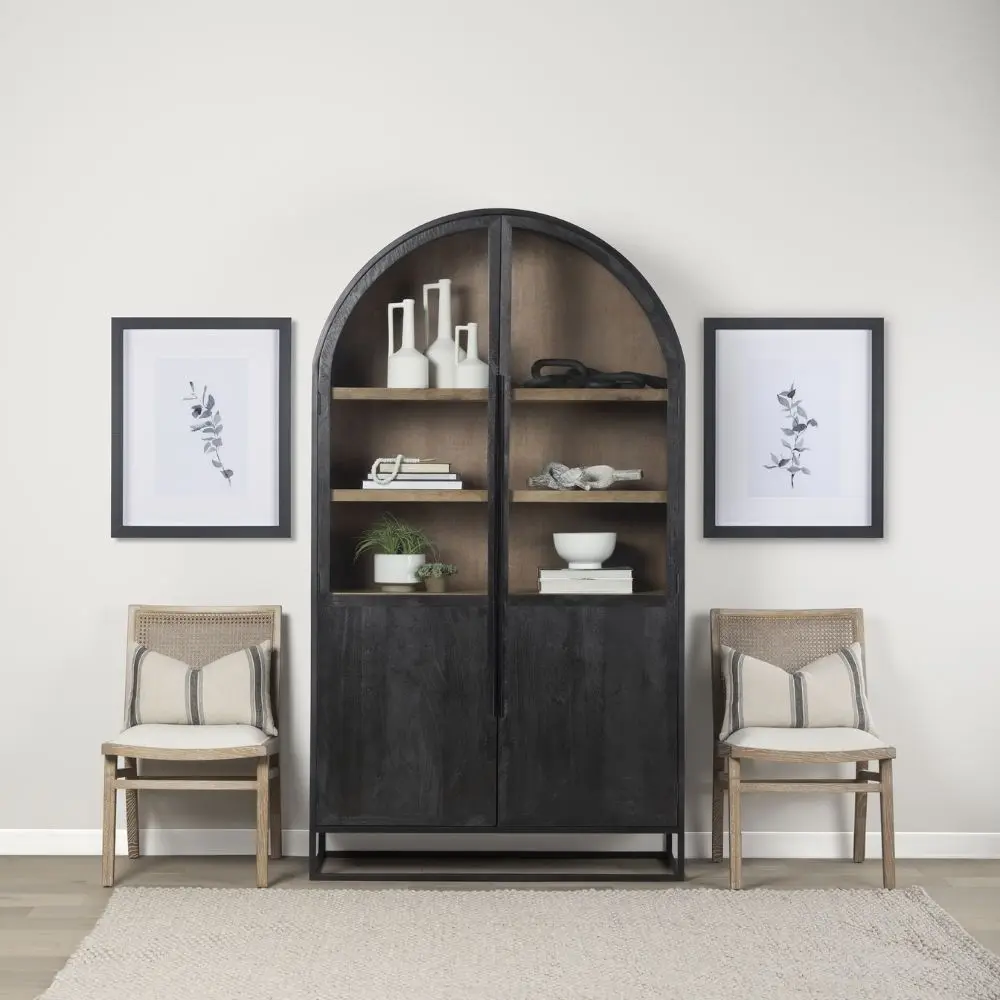 A tall arched black wood cabinet with open shelving and a black metal frame, featuring natural wood interior and closed bottom doors.