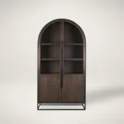Tall arched cabinet in dark brown wood with black metal frame and glass panel doors – Mercana Sloan Cabinet
