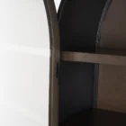 Tall arched cabinet in dark brown wood with black metal frame and glass panel doors – Mercana Sloan Cabinet