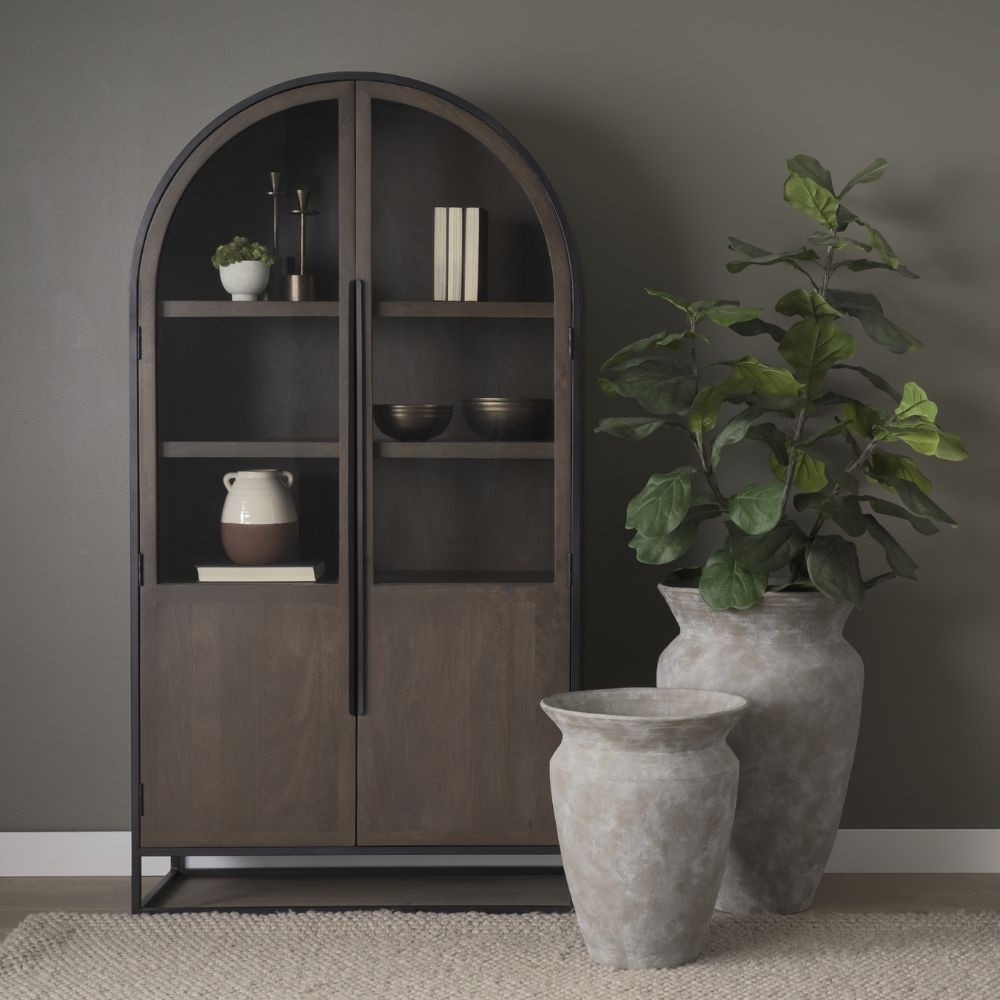 Tall arched cabinet in dark brown wood with black metal frame and glass panel doors – Mercana Sloan Cabinet