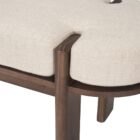 Modern wood-framed bench with rounded edges and a neutral upholstered cushion.