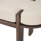 Modern wood-framed bench with rounded edges and a neutral upholstered cushion.
