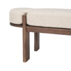 Modern wood-framed bench with rounded edges and a neutral upholstered cushion.
