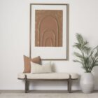 Modern wood-framed bench with rounded edges and a neutral upholstered cushion.
