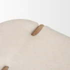 Light oak bench with rounded upholstered cushion in soft neutral fabric.