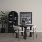 Round black solid wood accent table with chunky legs and sculptural design – Mercana Soma Table.