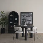 Round black solid wood accent table with chunky legs and sculptural design – Mercana Soma Table.