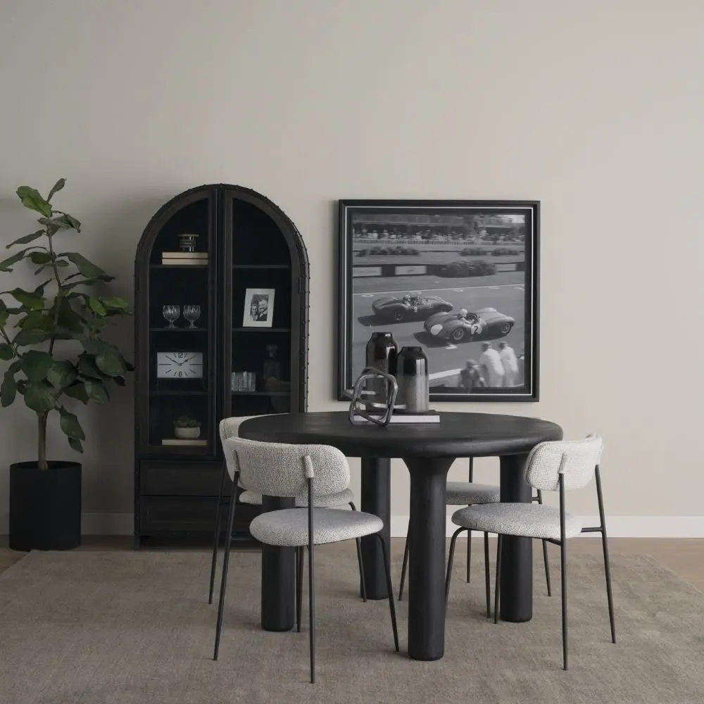 Round black solid wood accent table with chunky legs and sculptural design – Mercana Soma Table.