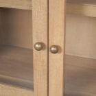 Light natural wood arched cabinet with glass doors, three shelves, and six lower drawers.
