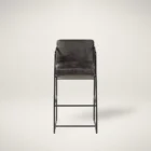 Black leather and metal frame bar stool with minimalist silhouette and slim profile.