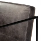 Black leather and metal frame bar stool with minimalist silhouette and slim profile.