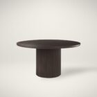 Round dark wood dining table with fluted cylindrical pedestal base.