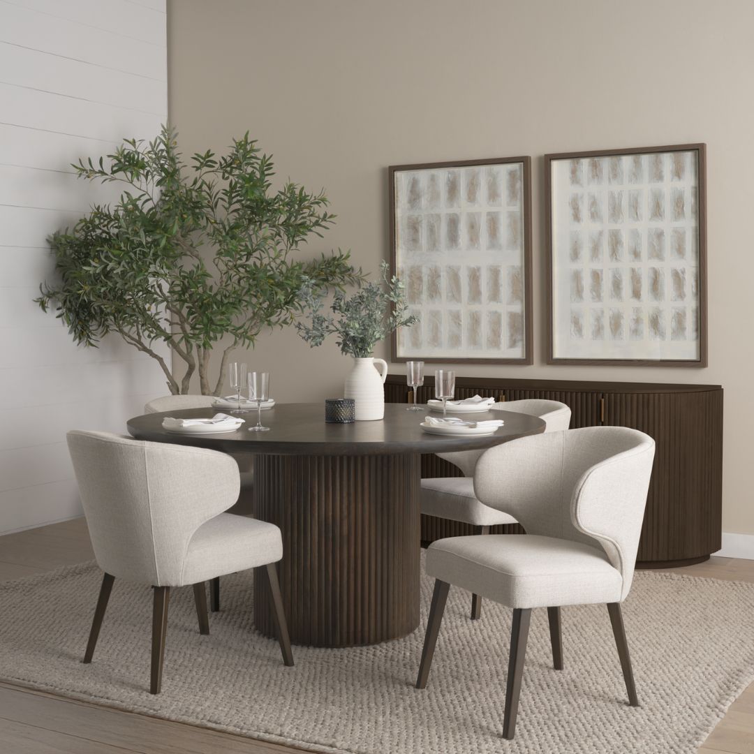 Round dark wood dining table with fluted cylindrical pedestal base.