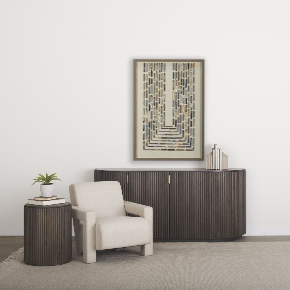 Dark fluted wood sideboard with rounded corners and brass handles.
