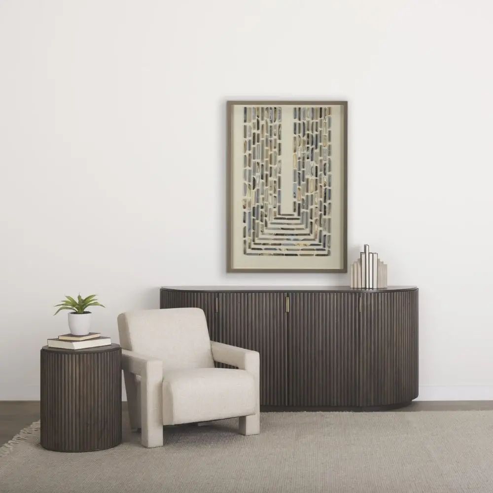 Dark fluted wood sideboard with rounded corners and brass handles.