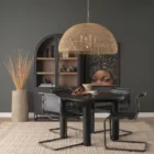 Large dome-shaped chandelier featuring a woven rattan-style metal frame with gold finish and inner candelabra-style bulbs.