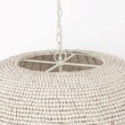 Boho-style dome pendant light with hand-beaded white finish and woven texture.