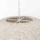 Boho-style dome pendant light with hand-beaded white finish and woven texture.