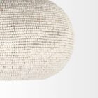 Boho-style dome pendant light with hand-beaded white finish and woven texture.