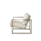 Mercana Watson accent chair featuring a modern metal frame with white boucle upholstery and wood armrests.