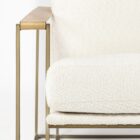 Mercana Watson accent chair featuring a modern metal frame with white boucle upholstery and wood armrests.