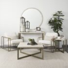 Mercana Watson accent chair featuring a modern metal frame with white boucle upholstery and wood armrests.