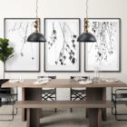 Mercana Willson pendant light featuring a matte black dome shade and sculptural antique gold spindle stem.