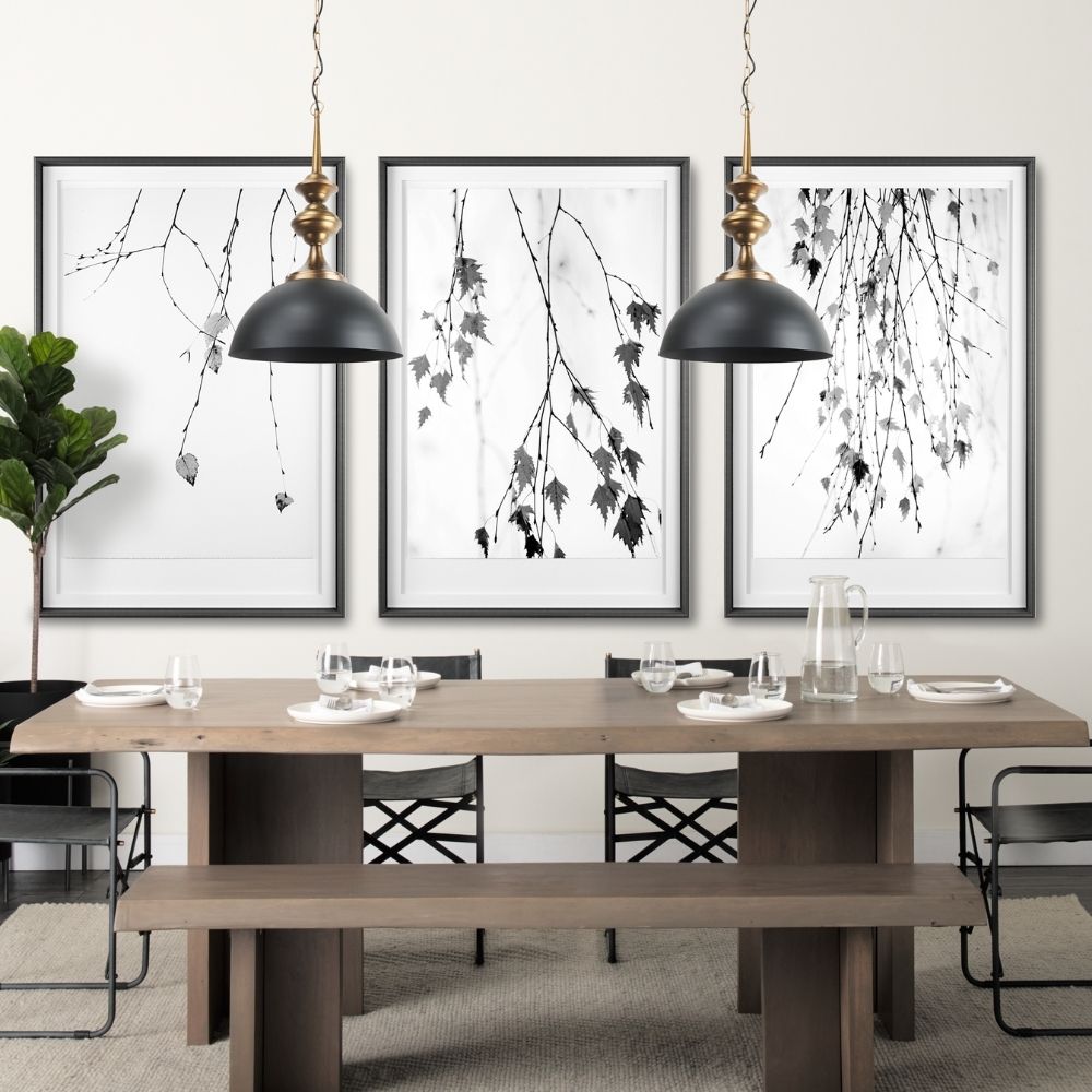 Mercana Willson pendant light featuring a matte black dome shade and sculptural antique gold spindle stem.