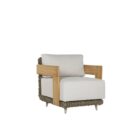 Outdoor lounge chair with white cushions, woven wicker frame, and teak wood arms.