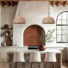 Natural rattan dome pendant light with brass-finished suspension chain.