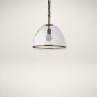 Glass dome pendant light with antique brass accents and exposed bulb, suspended by a matching brass chain.