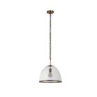 Glass dome pendant light with antique brass accents and exposed bulb, suspended by a matching brass chain.