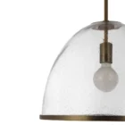 Glass dome pendant light with antique brass accents and exposed bulb, suspended by a matching brass chain.