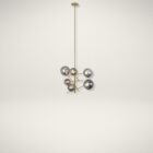 Modern gold chandelier with staggered rods and smoky mirrored glass globe shades