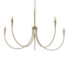 Brushed brass six-arm chandelier with curved arms and minimalist candelabra bulbs.