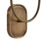 Double-arm wall sconce with antique brass finish and white fabric shades.