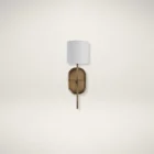 Brushed brass wall sconce with a white cylindrical fabric shade and elongated backplate.