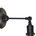 Vintage-style wall sconce with clear glass cone shade and matte black base.